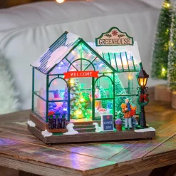 Plow & Hearth Decorative Accents>Holiday Poinsettia LED Table Decor Resin Greenhouse with Rotating Tree and Music, 8"